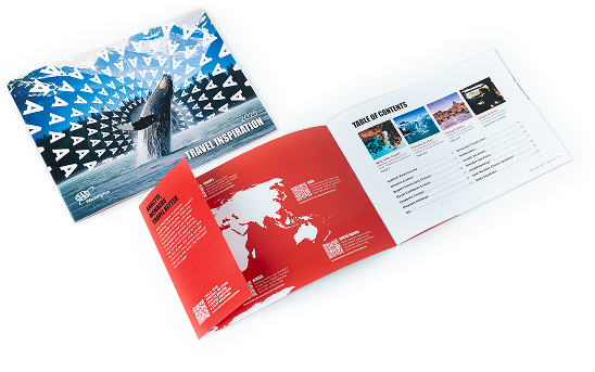 A Direct Mail booklet is laid face-up and then spread open. The exterior has bold imagery while the inside features a QR code.